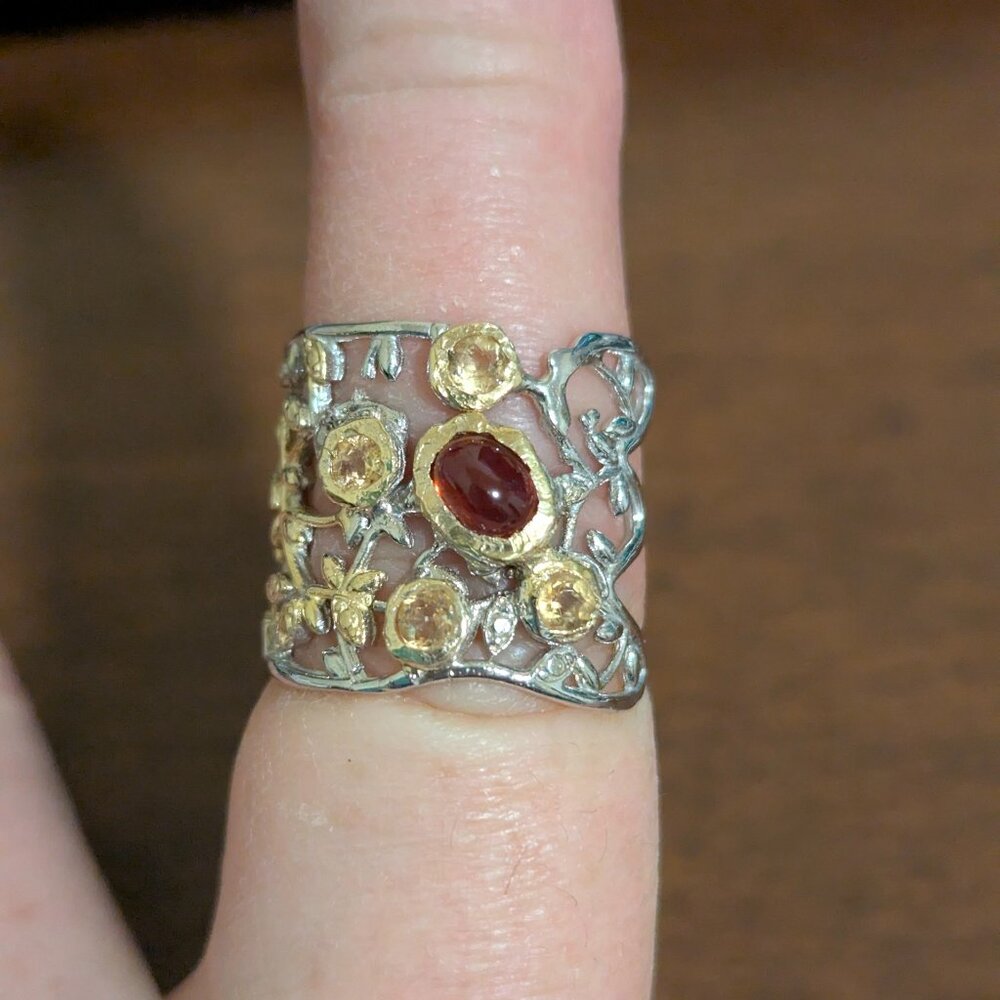 Two-Tone Floral Filigree Ring with Garnet Center and Golden Accents
